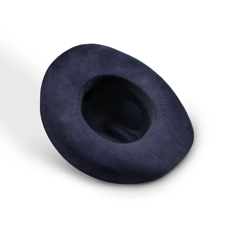 A navy blue felt wide-brimmed cowboy hat with a black sweatband lining.