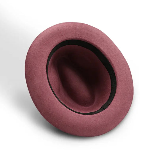 Dusky rose felt fedora with a black sweatband.