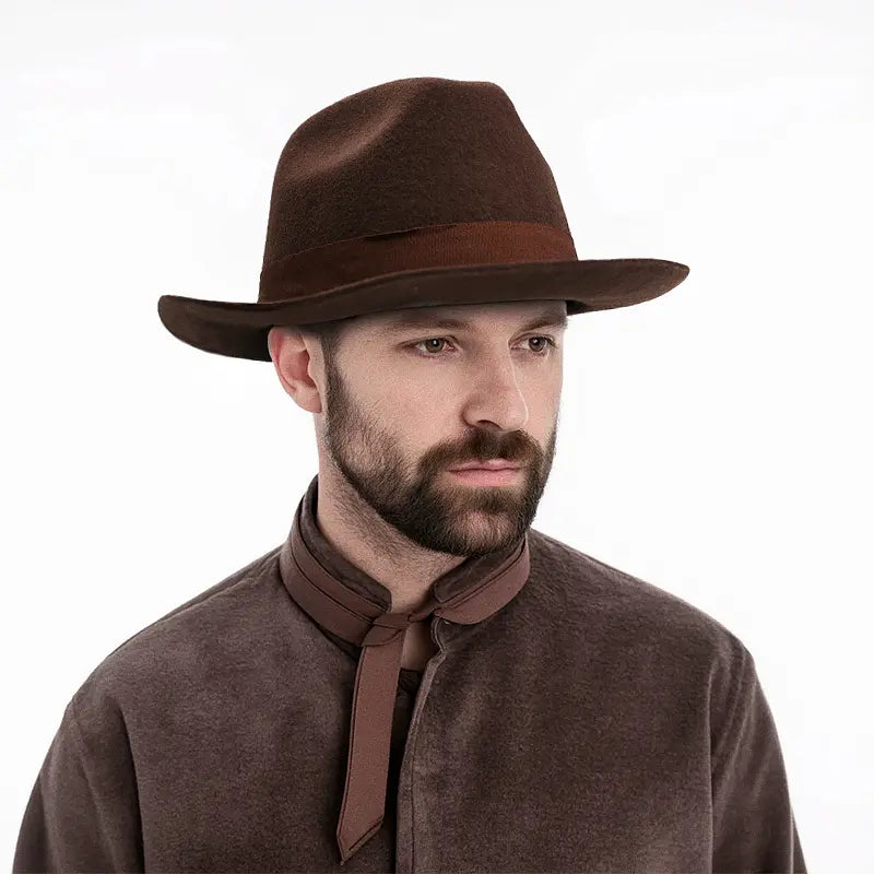 The man in the brown turtleneck sweater wears a brown felt fedora hat with a brown hatband.