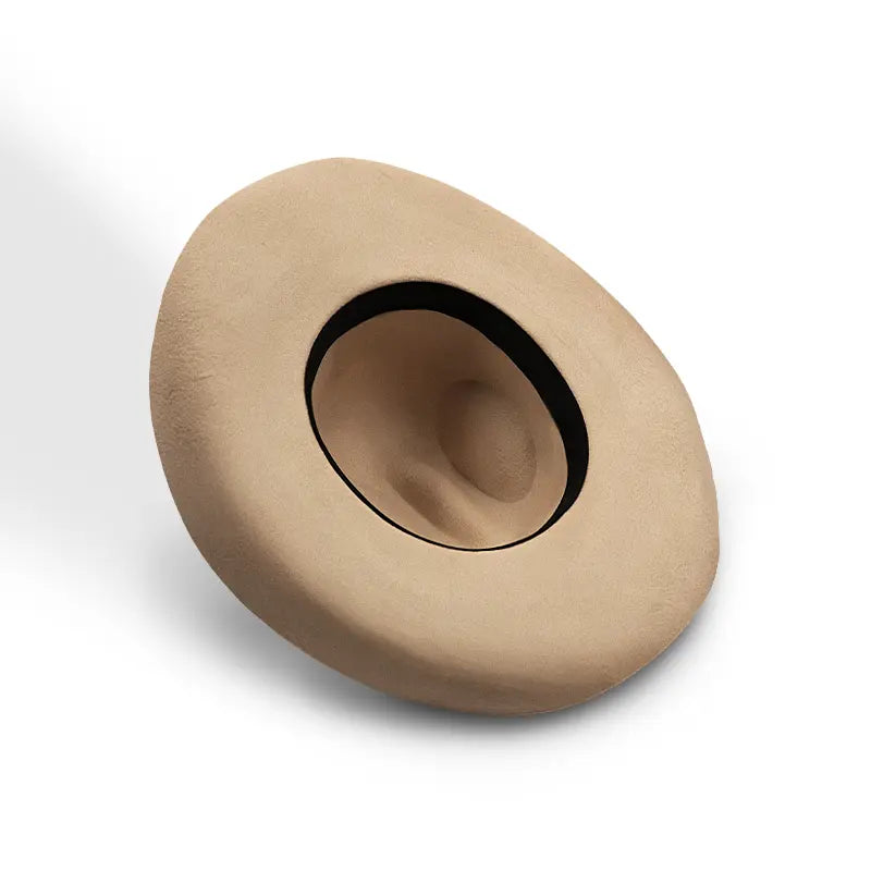 Beige felt wide-brimmed cowboy hat with a black sweatband lining