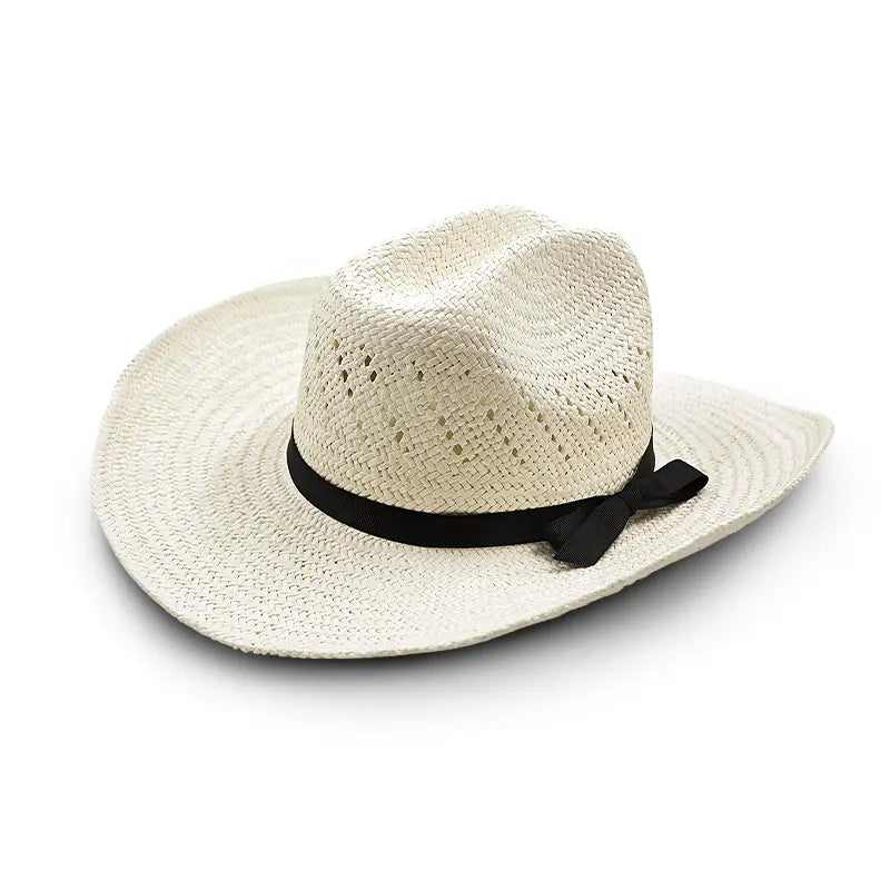 White straw cowboy hat with a black ribbon and bow, featuring perforations for ventilation.