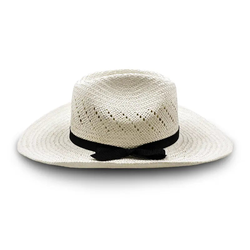 White straw cowboy hat with a black ribbon and bow, featuring perforations for ventilation.