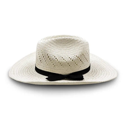 White straw cowboy hat with a black ribbon and bow, featuring perforations for ventilation.