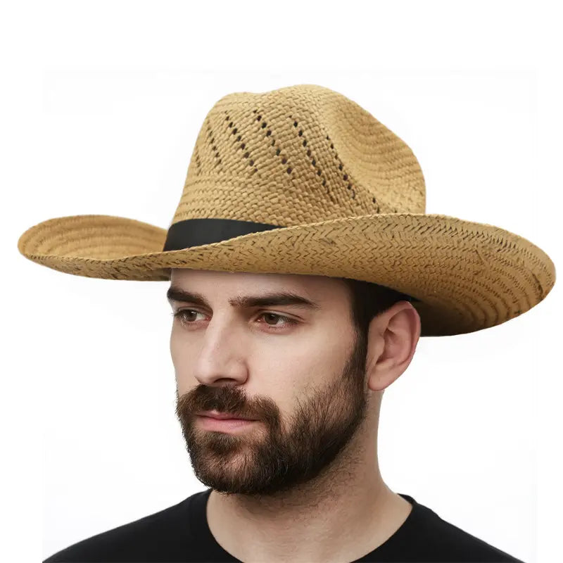 A man wearing a black shirt wears a light khaki straw cowboy hat with a black ribbon.