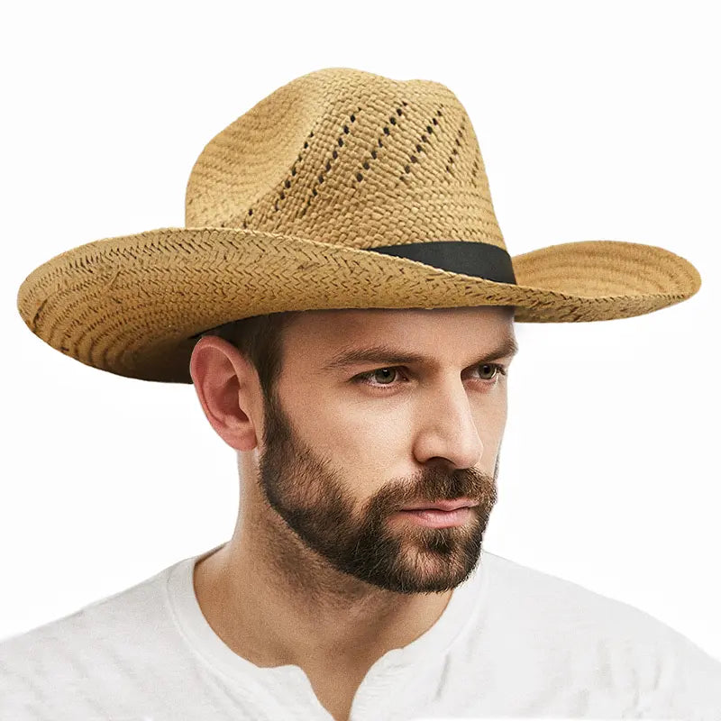 A man wearing a white shirt wears a light khaki straw cowboy hat with a black band.