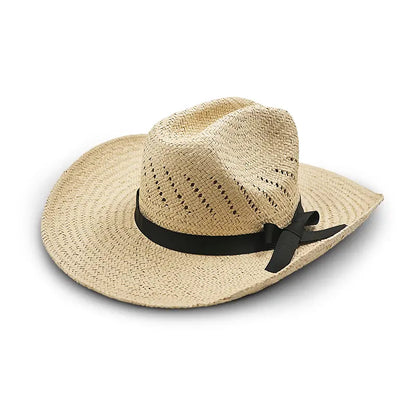 Off-white straw cowboy hat with a black ribbon and bow, featuring perforations for ventilation.