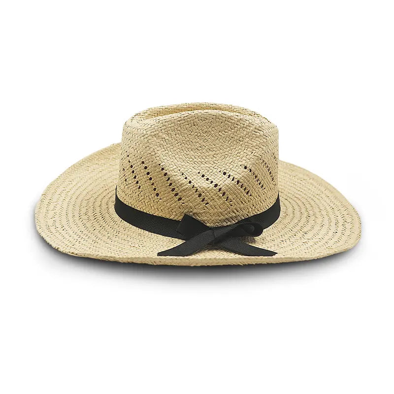 Off-white straw cowboy hat with a black ribbon and bow, featuring perforations for ventilation.