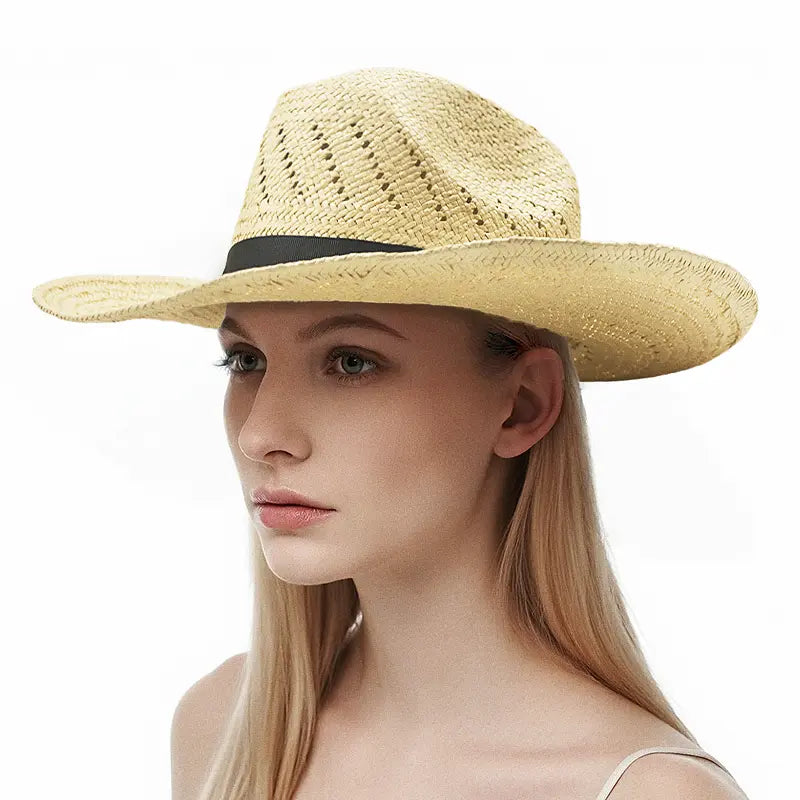 Model wears a beige straw wide-brimmed hat with a black band.