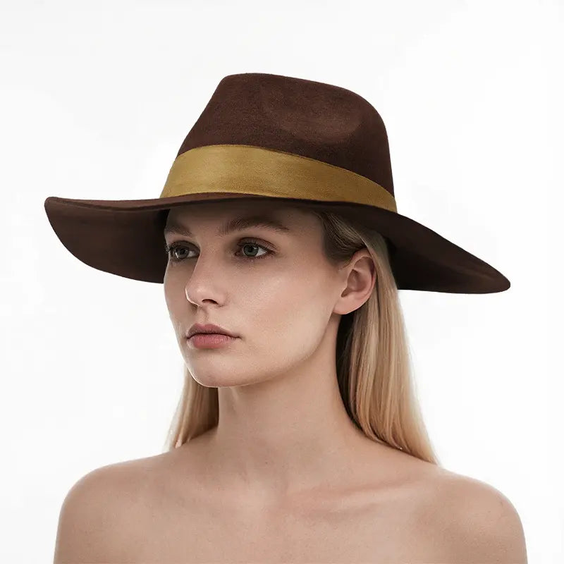 The model is wearing a brown felt wide-brimmed fedora hat with a tan band.