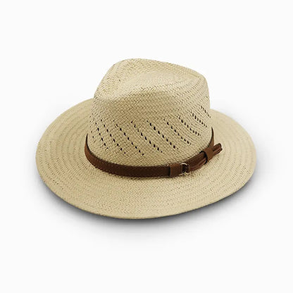Beige woven wide-brimmed straw hat with a perforated crown for ventilation and a brown leather strap with a metal buckle.
