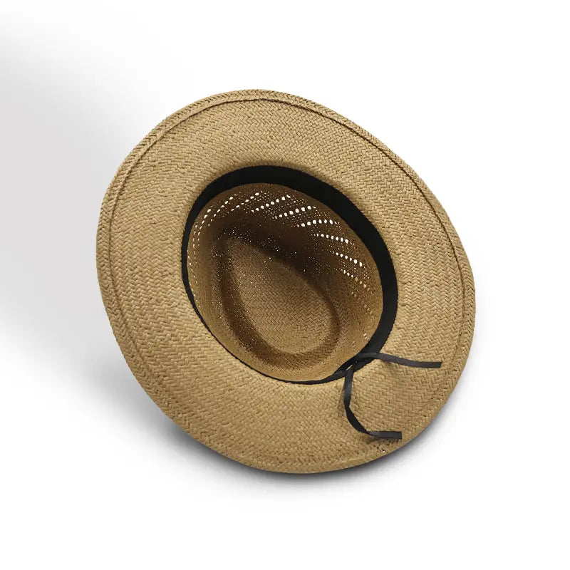 Light brown straw wide-brimmed hat lined with a black sweatband and fitted with an adjustment cord.