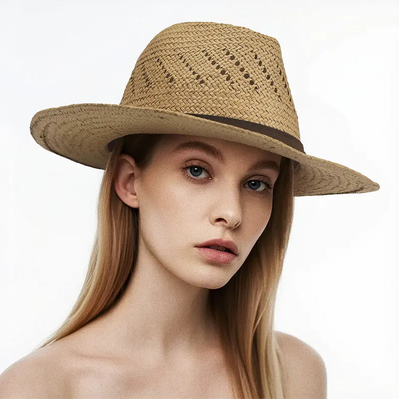 The model is wearing a light brown straw wide-brimmed hat with perforated design and a dark brown band.