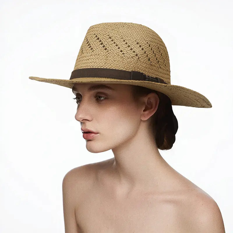 The model is wearing a light brown straw wide-brimmed hat with perforated design and a dark brown band.