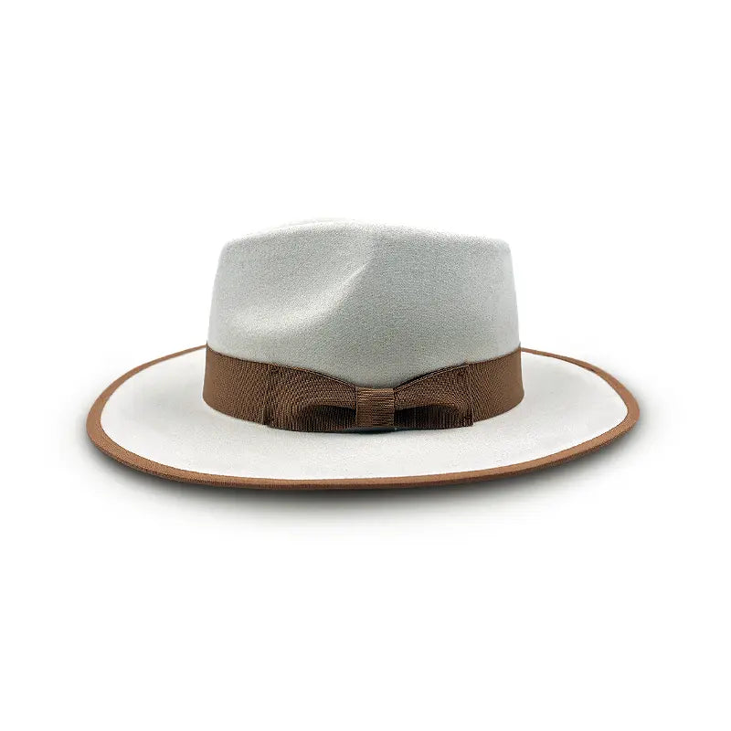 White wide - brimmed hat with brown trim on the brim and a brown bow - shaped band