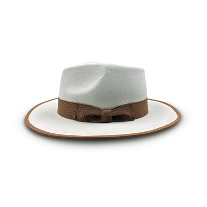 White wide - brimmed hat with brown trim on the brim and a brown bow - shaped band