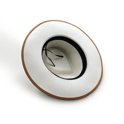 White wide - brimmed hat with brown trim around the brim and black inner lining with thin straps inside