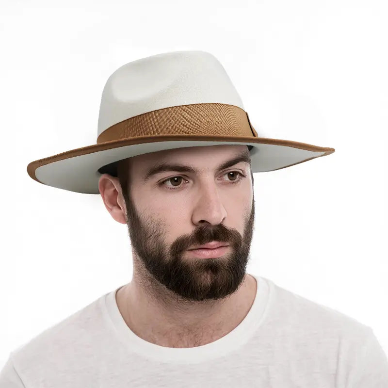 Man wearing a white wide - brimmed hat with brown band and brim trim, white crewneck shirt