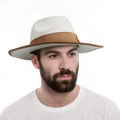 Man wearing a white wide - brimmed hat with brown band and brim trim, white crewneck shirt