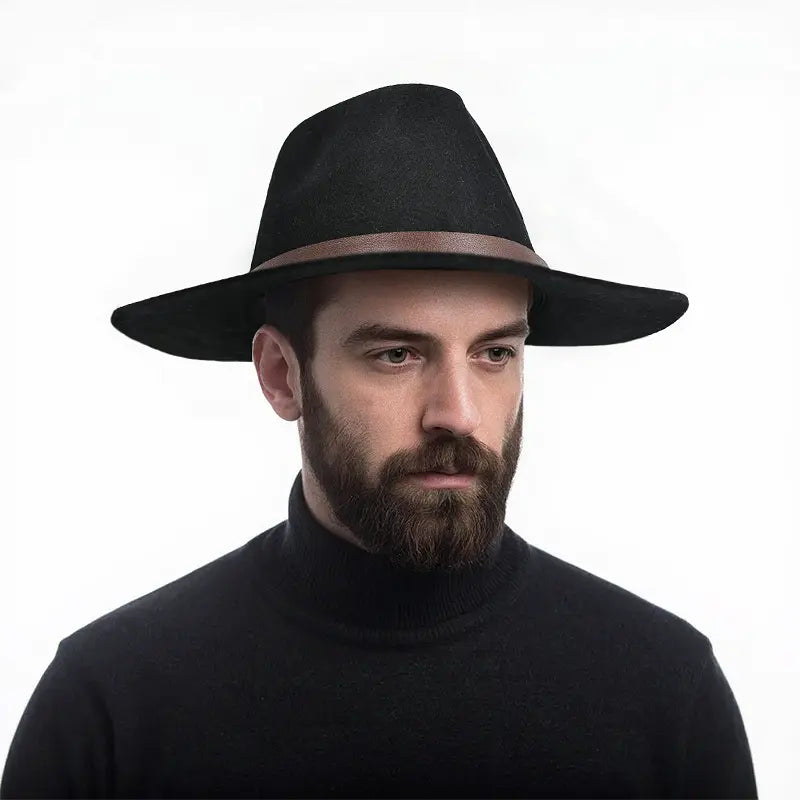 Man wearing black wide - brimmed fedora hat with brown leather band, black turtleneck sweater


