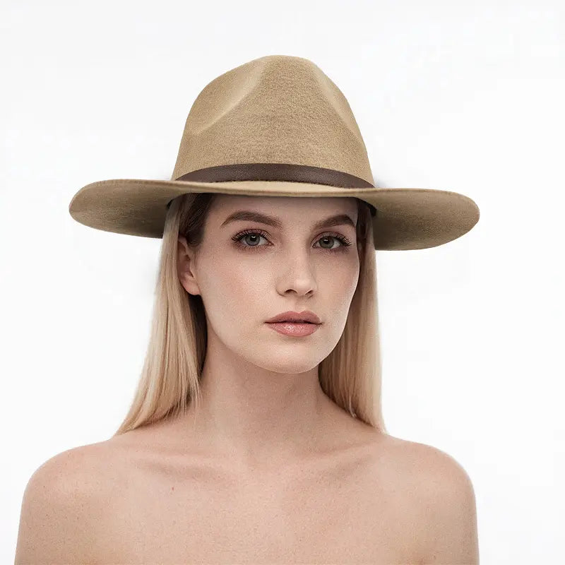 Woman wearing light khaki wide - brimmed hat with brown leather band