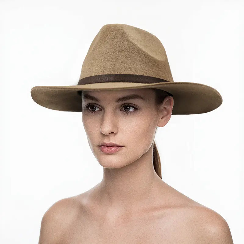 Woman wearing light khaki wide - brimmed hat with brown leather band